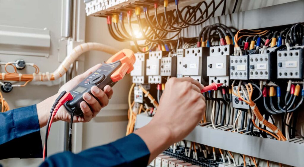 Electrical work being done on an electrical wired board