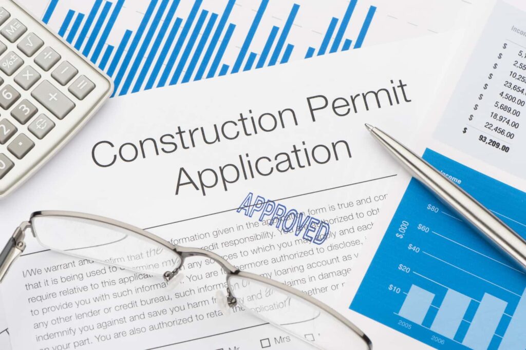 a paper that reads "construction permit application"